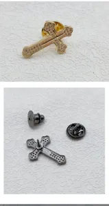 Exquisite cross brooch detail showing paved rhinestones, metal pin and secure butterfly clutch.