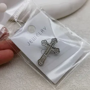 Rhinestone cross brooch detail, elegant copper suit accessory for business attire and daily wear.