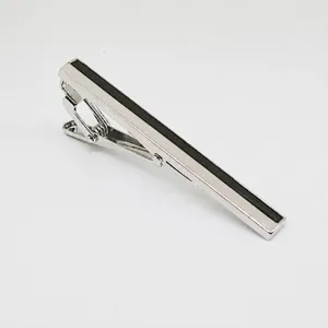 Silver metal tie clip detail, black stripe inlay, minimalist design for men business shirt wear.
