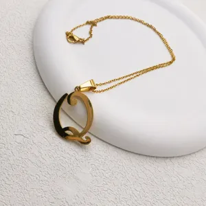 Detailed shot of a stylish gold-tone stainless steel letter pendant necklace for daily wear.