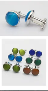 Detailed shot of round cat eye stone metal cufflinks for men business shirts suit accessories
