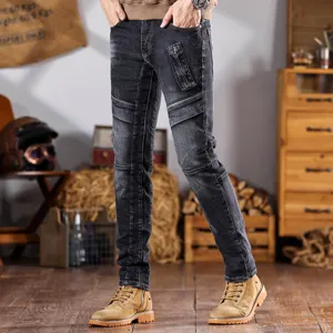 Vaqueros de moto slim grises vintage para hombre con paneles y bolsillos elegantes.