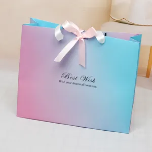 Gradient paper gift bag with ribbon bow for business gifts, wedding favors and stores.
