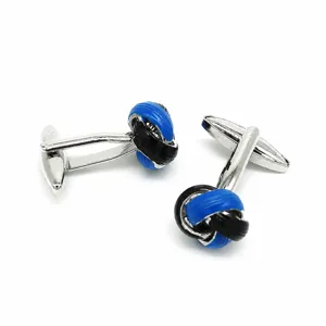French style blue and black twisted rope metal cufflinks detail shot for men's formal wear.