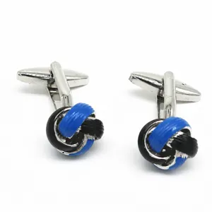 Closeup detail of the blue and black twisted knot cufflinks with silver metal base.