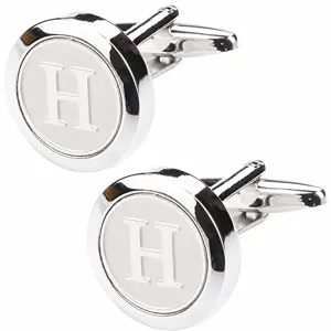 Detailed close-up view of silver-toned round men shirt letter H metal cufflinks.