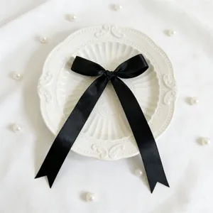 Fiocco in nastro di raso nero per confezione regalo e decorazione, accessorio fai da te elegante.