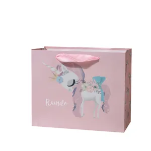 Pink unicorn paper gift bag with ribbon handles for kids party favors and candy packaging
