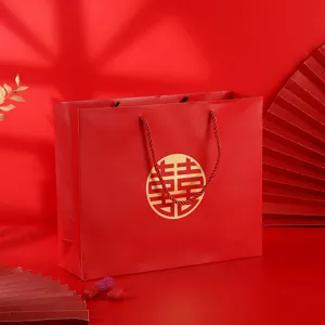 Red paper gift bag with double happiness symbol, perfect for wedding party favors and candy.
