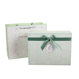 Fresh green gift box set with elegant dark green bow, perfect for birthday and party favors.
