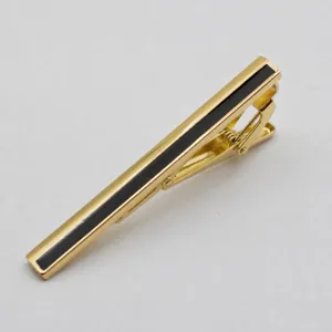 Gold-tone metal tie clip with black inlay, elegant business men's accessory for office wear.