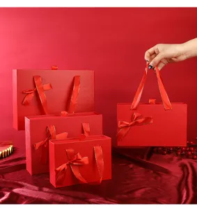 Vue detaillee de la boite cadeau ruban rouge, emballage tiroir elegant pour bonbons et parfum.