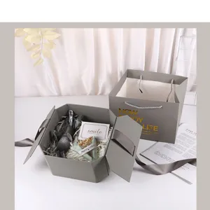 Gray octagonal gift box set with matching paper bag, ribbon handle, and elegant design.