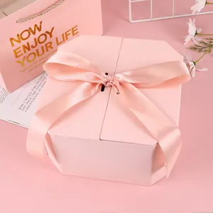 Pink octagonal gift box with satin ribbon bow for birthday, wedding and cosmetic packaging.