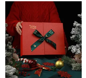 Detailed view of large red Christmas gift box with green ribbon, perfect for holiday packaging.