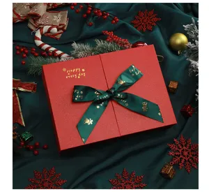 Christmas red gift box with green ribbon, large empty packaging for festive holiday presents.