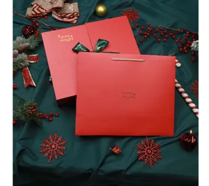 Red Christmas gift box set with paper bag, elegant gold stamping for holiday packaging.