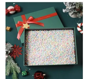 Christmas gift box set with colorful foam balls, festive red ribbon packaging decor.