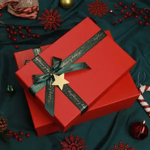 Red Christmas gift box set with green ribbon and star decor, perfect for holiday packaging.