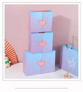 gradient gift box detail shot showing stacked boxes with heart clasp and matching paper bag