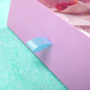 Pink drawer gift box with blue ribbon handle and clear window, perfect for cosmetics and packaging.
