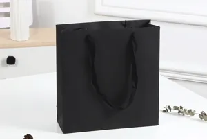 Black paper gift bag with fabric handles, thickened cardstock for business shopping and parties.