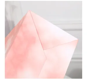 Pink marble gift paper bag detail view, elegant packaging bag for wedding party or birthday.