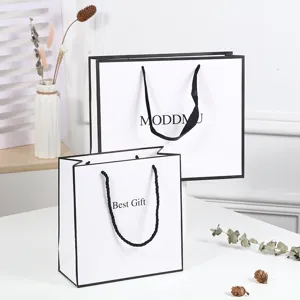 Minimalist White Paper Gift Bag Cardstock Shopping Bag With Black Handles For Retail Packaging And Party Favors