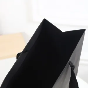 Premium black paper gift bag, thick cardstock shopping bag for birthdays and business gifts.