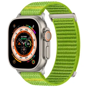 Green nylon alpine loop watch band for smartwatches, durable woven strap with metal hardware.