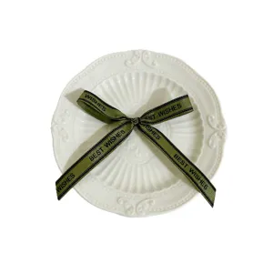 Green ribbon bow with English text printing, perfect for DIY gift box decoration and crafts.