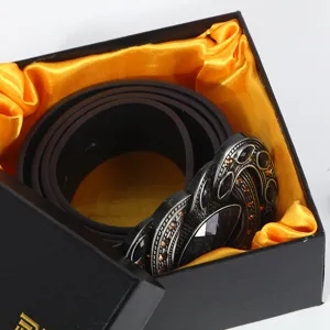 Luxury black leather belt with vintage ornate metal buckle presented in gift box with satin.