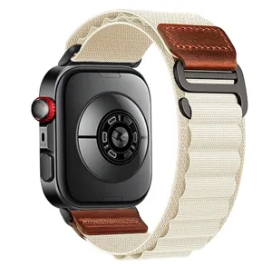 Detailed view of replacement nylon loop watch strap with brown leather accent and metal buckle.
