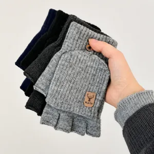 Knit convertible half-finger gloves detail showing soft cashmere-like fabric and leather logo patch.