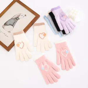 Detailed view of winter fluffy knit gloves featuring cute double heart patterns and plush lining.