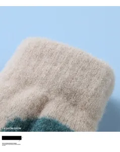 Detailed close-up view of kids winter warm fleece-lined knitted glove soft fabric texture.