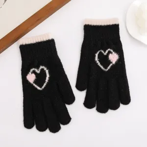 Winter knitted warm gloves featuring cute pink white heart pattern, soft and windproof daily wear.