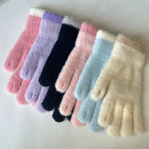 Detailed view of colorful plush knitted winter warm gloves featuring cozy ribbed cuffs.