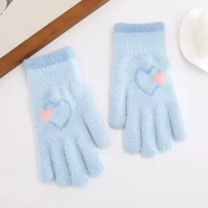 Blue knitted fuzzy gloves detail shot featuring cute heart pattern for winter warmth and daily wear.