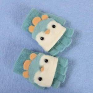 Cute children convertible half-finger winter gloves with playful dinosaur spine design details.