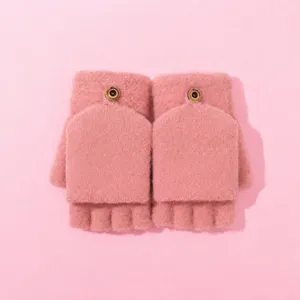 Pink knit convertible fingerless gloves detail, cozy warm winter knitwear accessory.