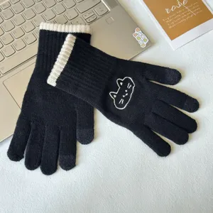 Black knit winter gloves with cute cat embroidery and touchscreen fingertips for women.