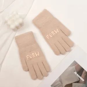 Cozy beige knit gloves featuring chic letter embroidery, perfect for winter warmth and daily wear.