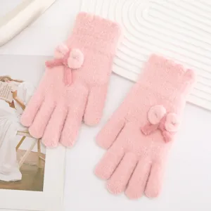 Pink knitted winter gloves with cute bow decoration, warm and soft touch screen gloves for women.