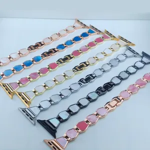 Stylish metal replacement strap compatible with Apple Watch, featuring geometric links and chic design.