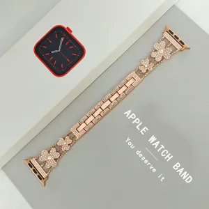 Detailed view of fashionable rose gold metal clover rhinestone watch band for Apple Watch.