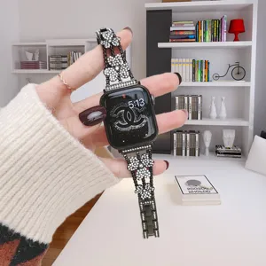 Rhinestone clover Apple Watch metal band detail view showcasing sparkling floral design.