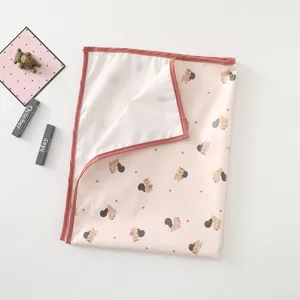 Detailed view of waterproof baby urine pad with cute squirrel print and soft breathable fabric.