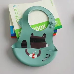 Waterproof silicone baby bib with cute raccoon cartoon pattern, soft and easy to clean.
