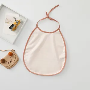 Waterproof baby bib with cute binding design, soft material detail view for infants and kids.